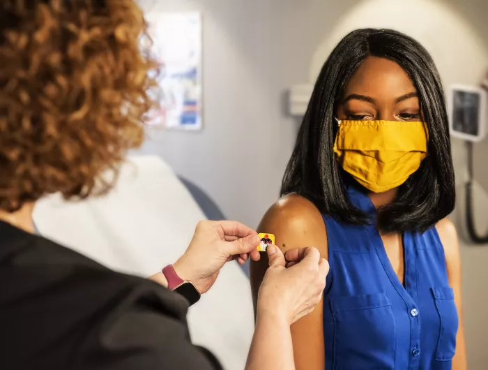 woman after being vaccinated for covid 19