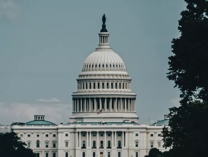 The U.S. Capitol Building with a hazy sky behind it