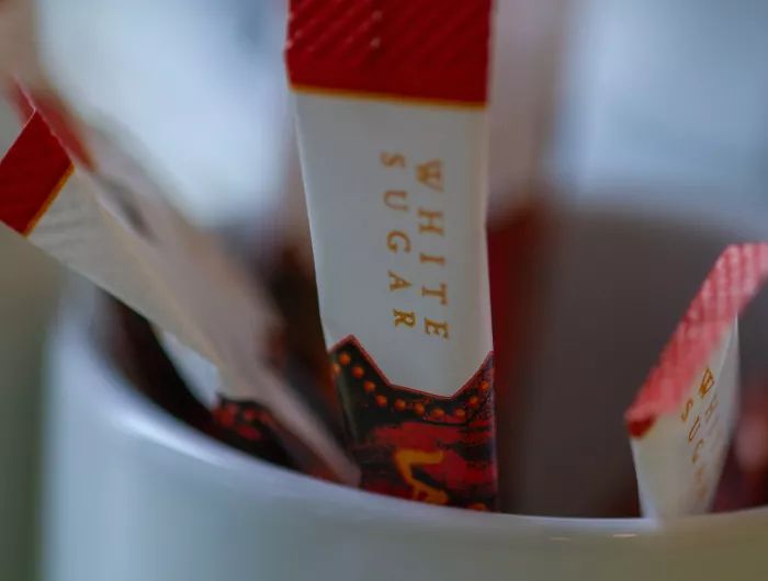 Bowl of sugar packets