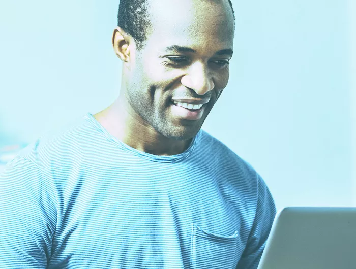 man looking at computer screen