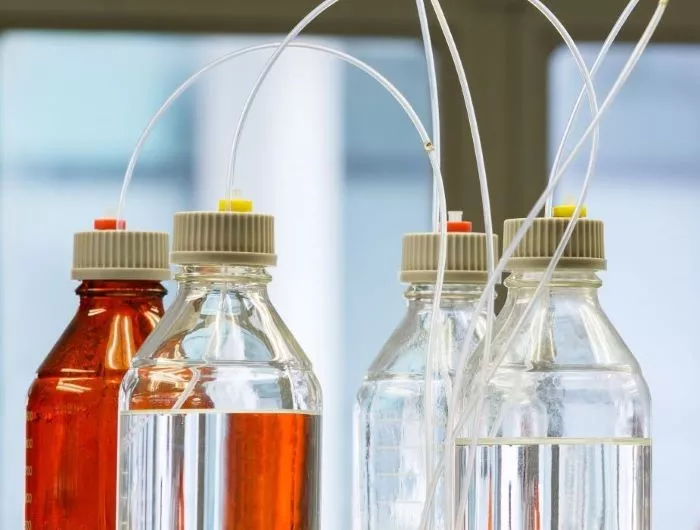 Glass bottles with plastic hose in flavor laboratory