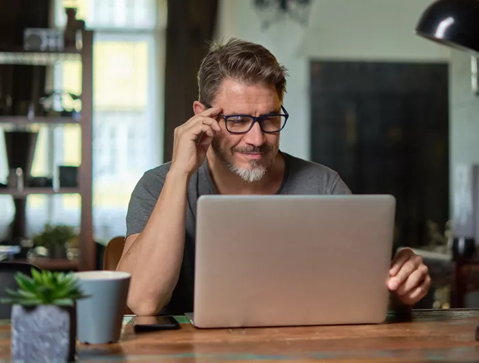 man looking at a computer screen