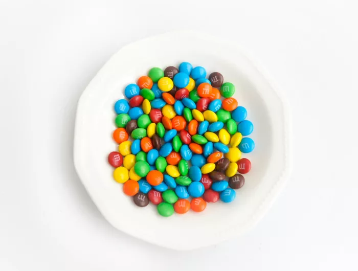 A white bowl of M&M candies