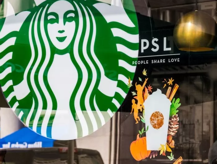 A Starbucks storefront advertising the annual Pumpkin Spice Latte