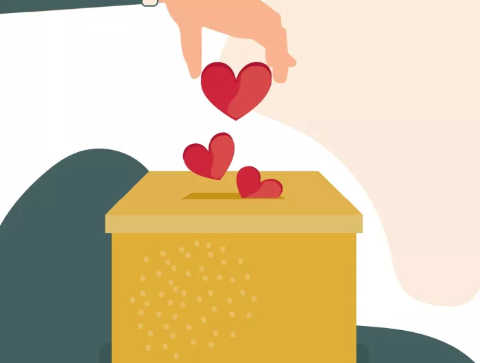 Charitable donation, gift, donors concept: An illustrated hand dropping hearts into a box