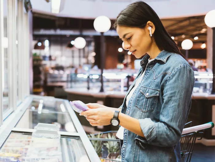 woman reading a package label