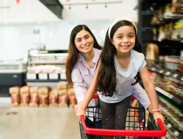A woman and girl grocery shop