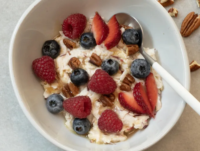 white bowl with berries and overnight oats