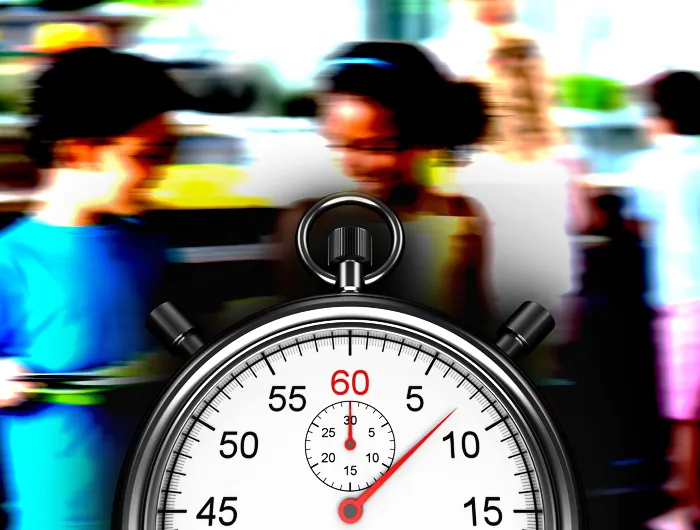Children holding school lunch trays with a stopwatch in front of them