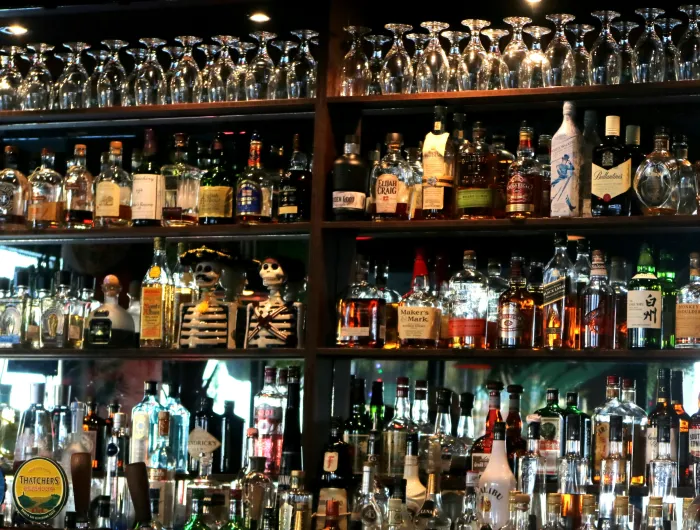 Bar shelf with a variety of liquor