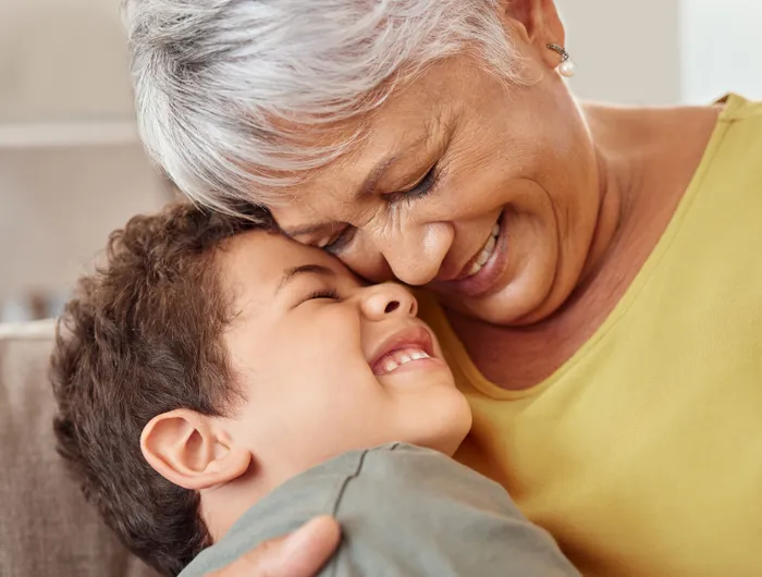 older woman laughing with young boy