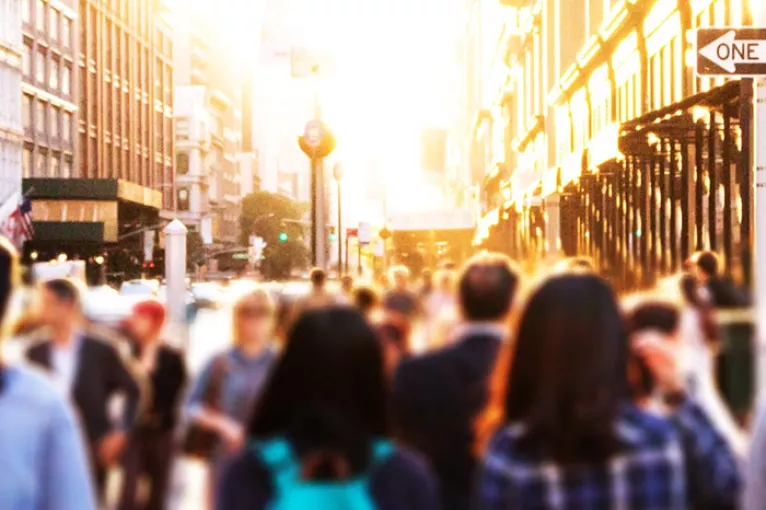 people walking on a city street