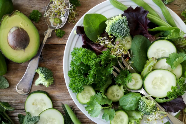 a salad full of green vegetables