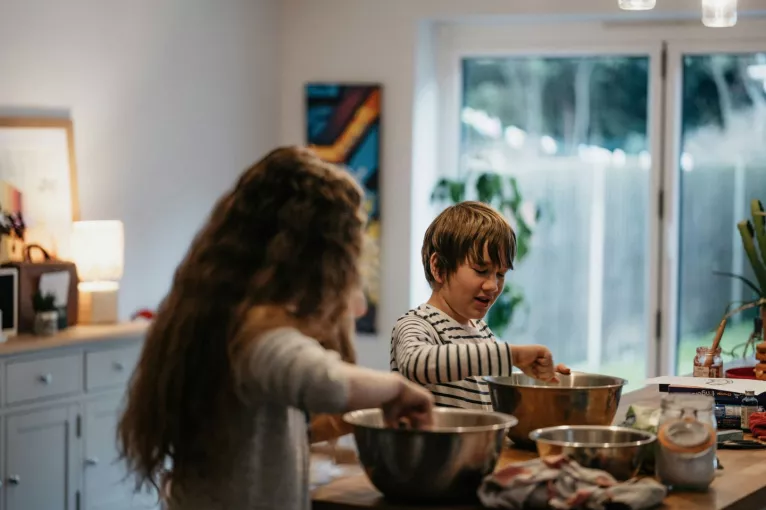 Children baking in kitchen, cooking family meal