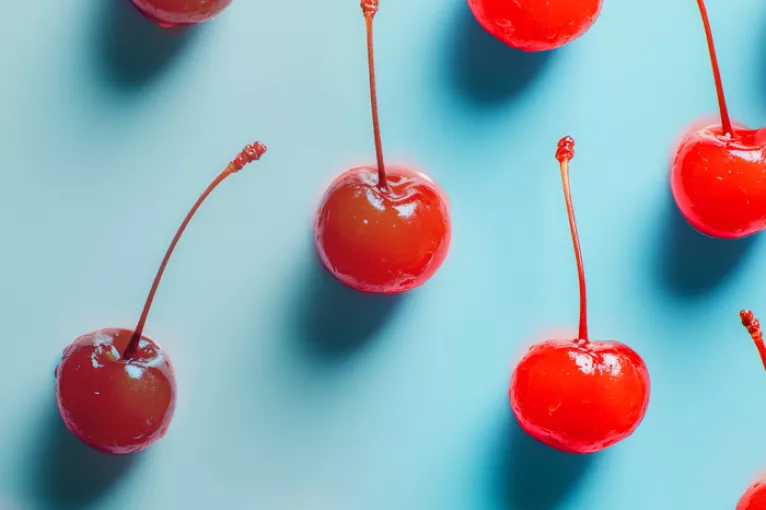 regular cherries fading into maraschino cherries