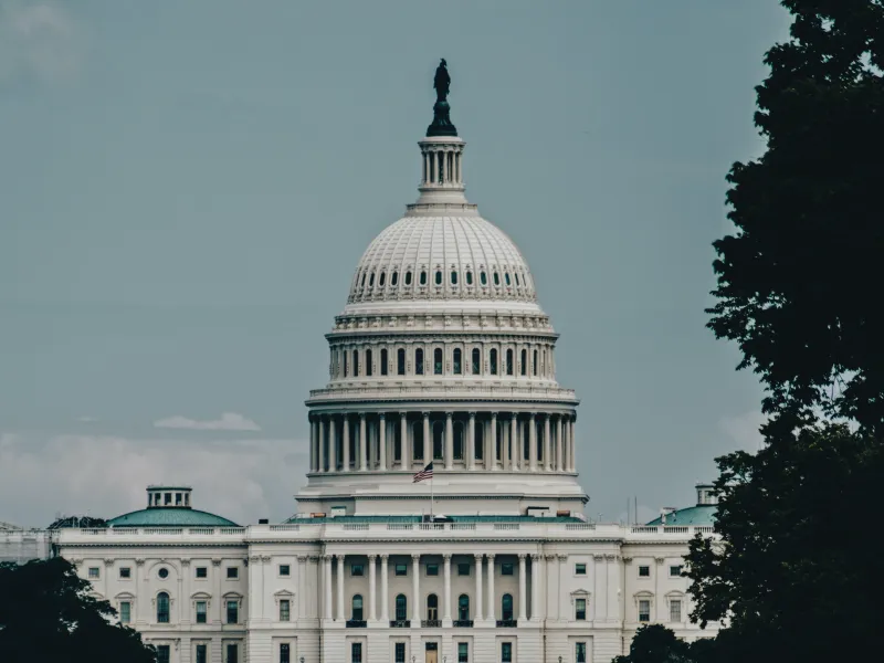 The U.S. Capitol Building with a hazy sky behind it