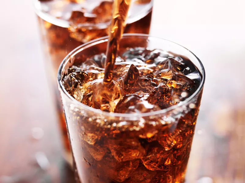 Two glasses of soda in a restaurant