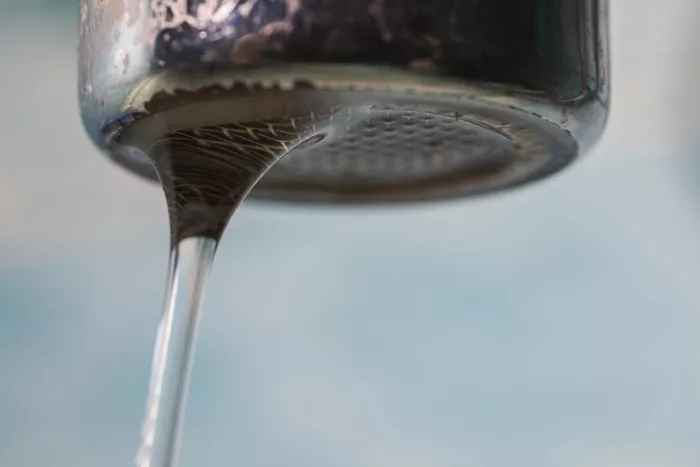 water coming out of a faucet