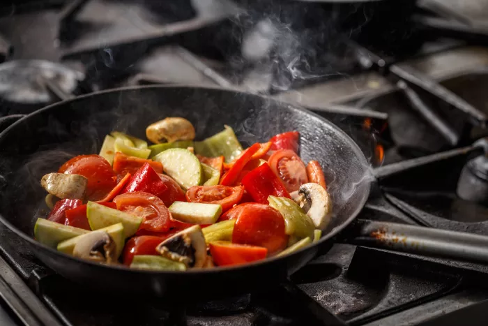 vegetables cooking in a skillet