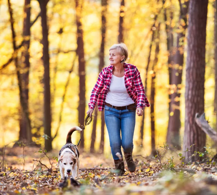 a woman walking her dog