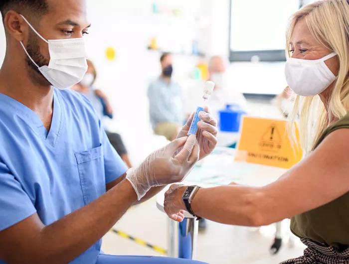 woman getting a vaccine