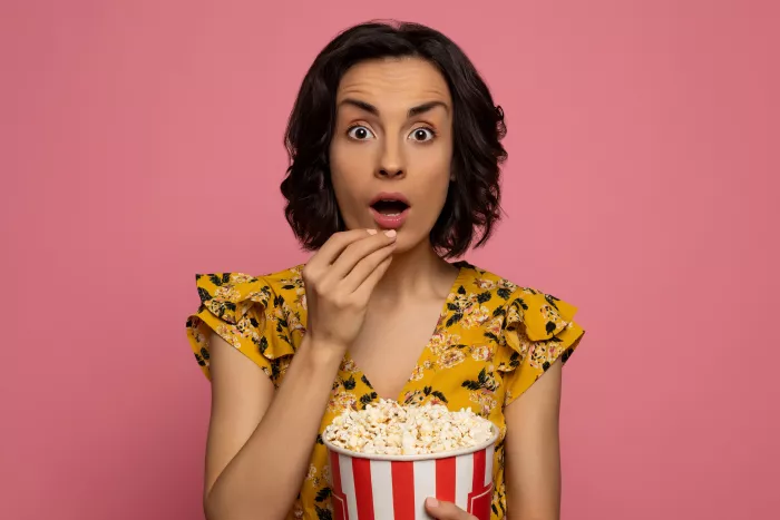 woman eating popcorn
