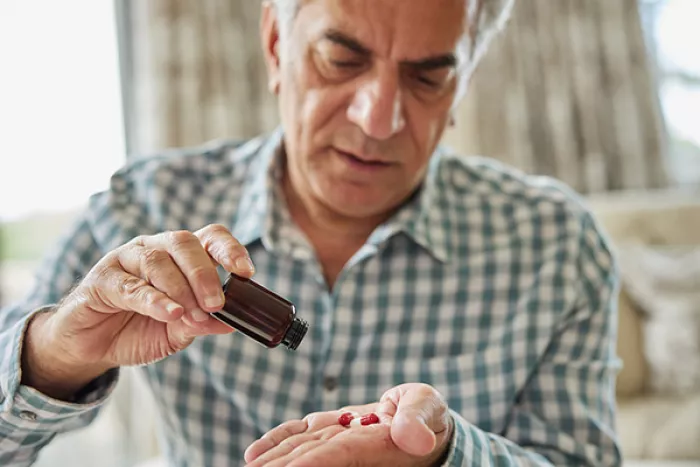 man taking pills