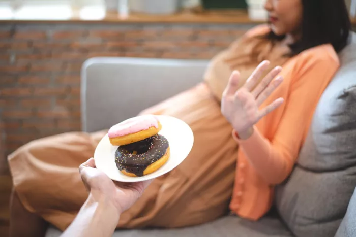 Pregnant woman refuses ultra-processed foods, healthy eating