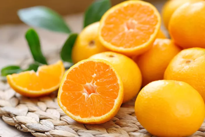 Seasonal produce - Citrus season isn't complete without fresh ripe oranges, shown here on a woven mat