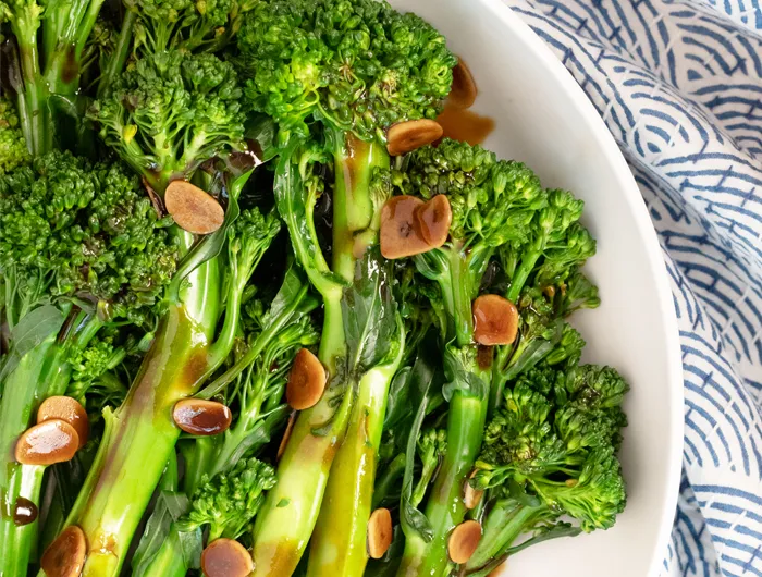 plate of broccolini in garlic sauce