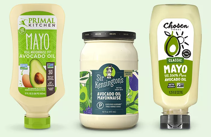 Primal Kitchen Real Mayo made with avocado oil, Sir Kingston's avocado oil Mayo, Chosen foods classic Mayo made with 100% avocado oil lined up on green background.