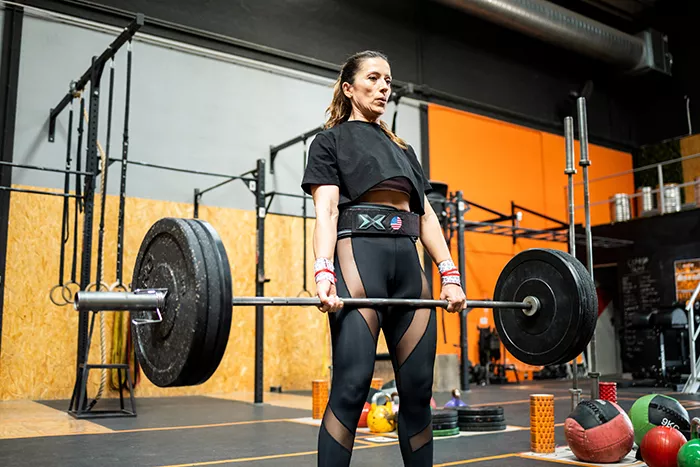 woman in gym deadlifting