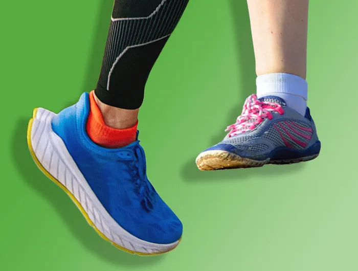 foot with blue maximalist running shoe (left) and foot with grey and pink minimalist shoe (right)