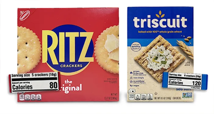 Box of Ritz crackers (left) with close up on 80 cal per serving label. box of Triscuit crackers (right) with close up of 120 cals per serving.