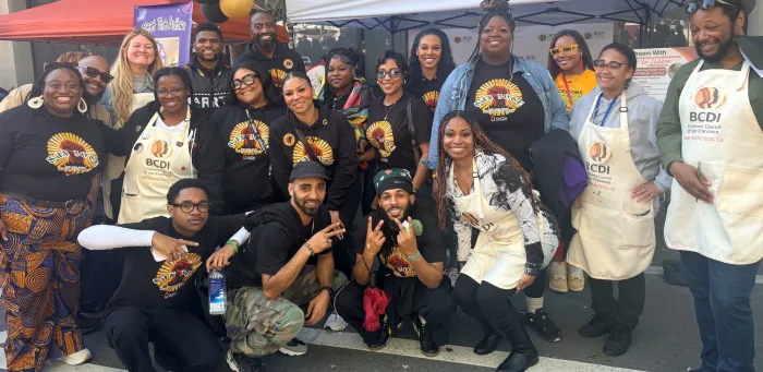 Attendees at a BCDI event do a movement exercise together