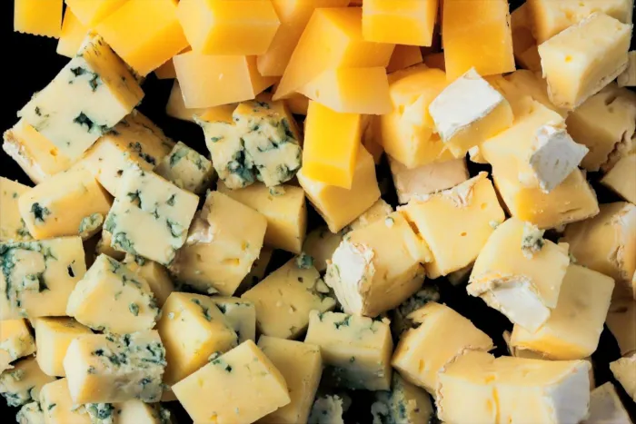 Cubes of blue and cheddar cheeses