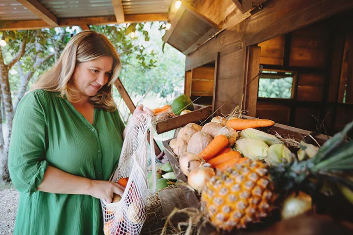 woman buying fresh fruit at farmers market