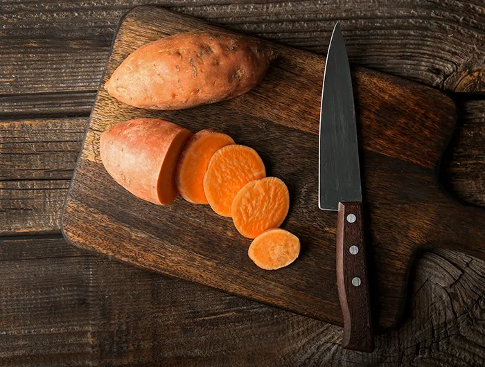 Sweet potatoes on a cutting board