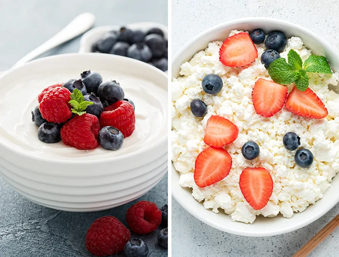 bowl of greek yogurt topped with berries (left) and bowl of cottage cheese topped with berries (right)