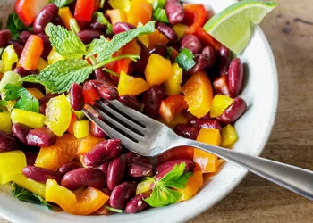 bean and veggie salad mix with a fork