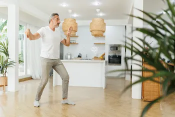 man doing tai chi in his home