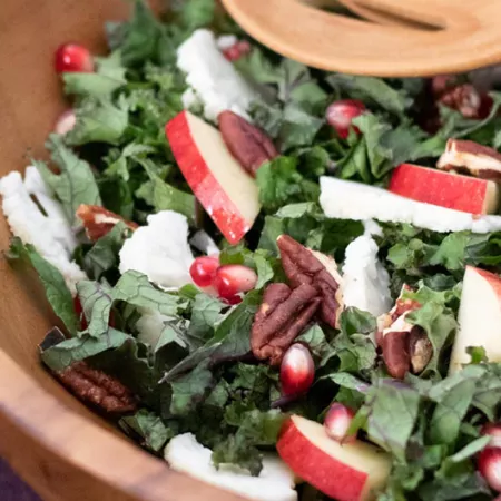 salad with kale, apples, pecans, and pomegranate
