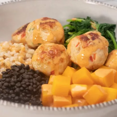 chicken meatballs with an assortment of sides