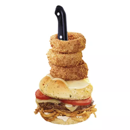 burger with onion rings stacked on top