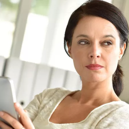 woman holding a tablet screen