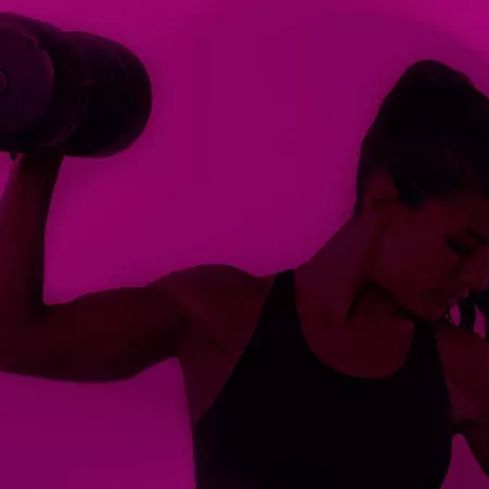 strong woman holding dumbbell