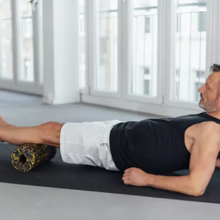 man using an exercise roller