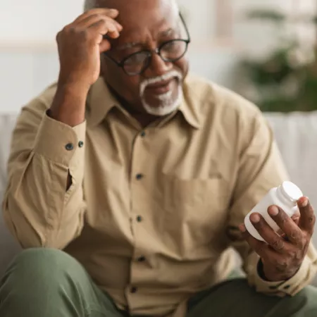 man holding pills