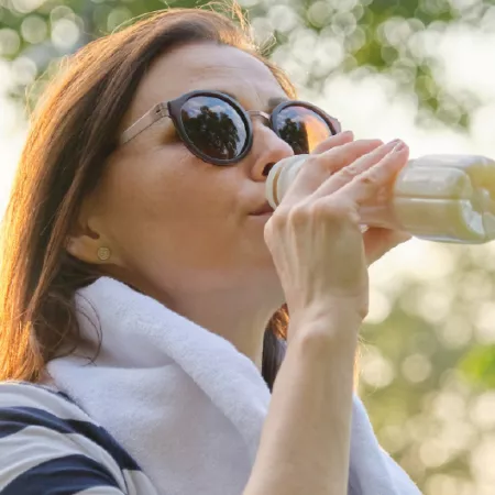 Woman drinking fermented beverage