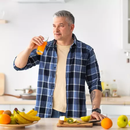 man drinking juice